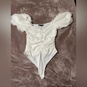 White lace ruffle onesie.